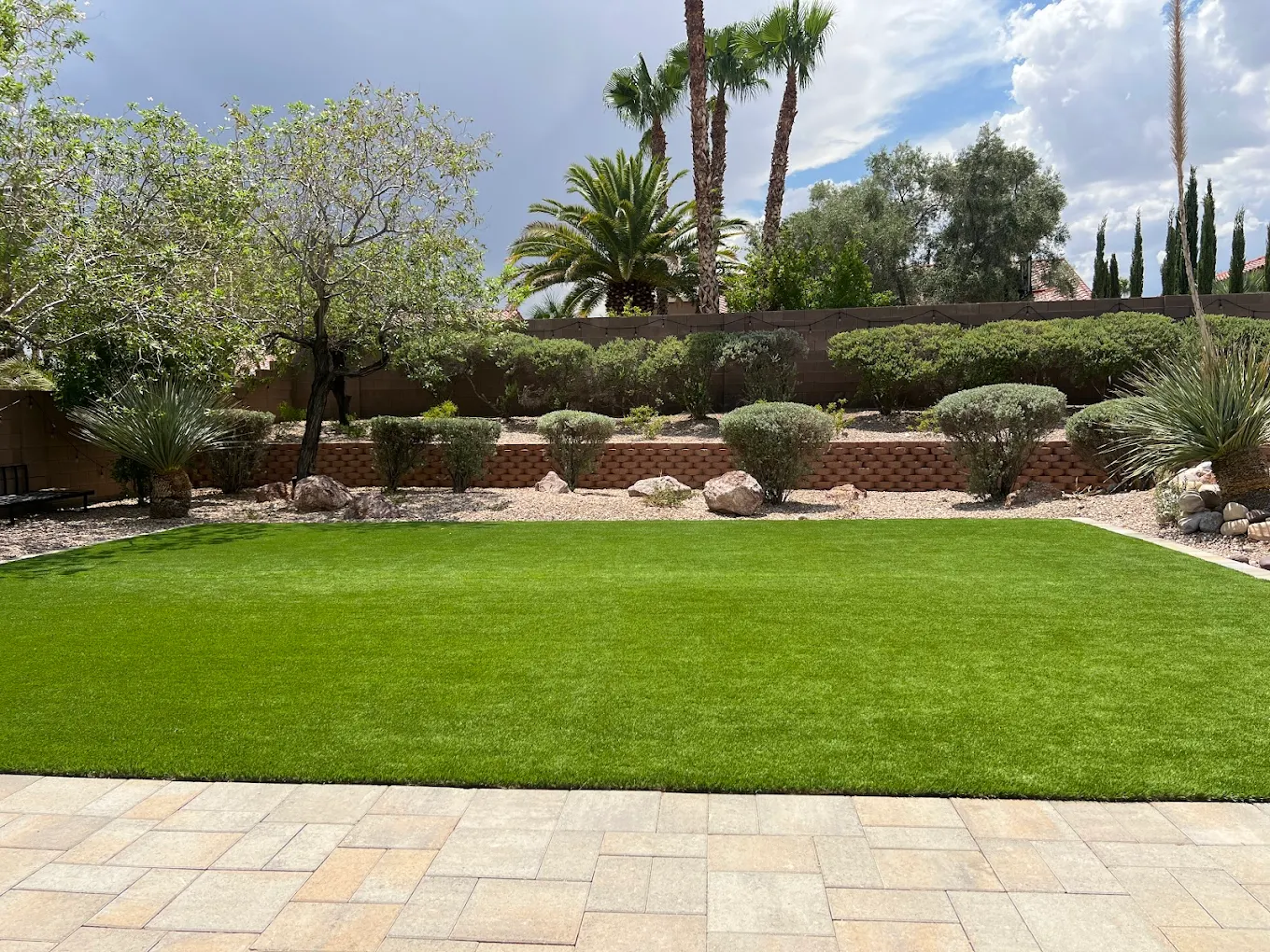 Clean artificial turf with desert landscaping in Las Vegas