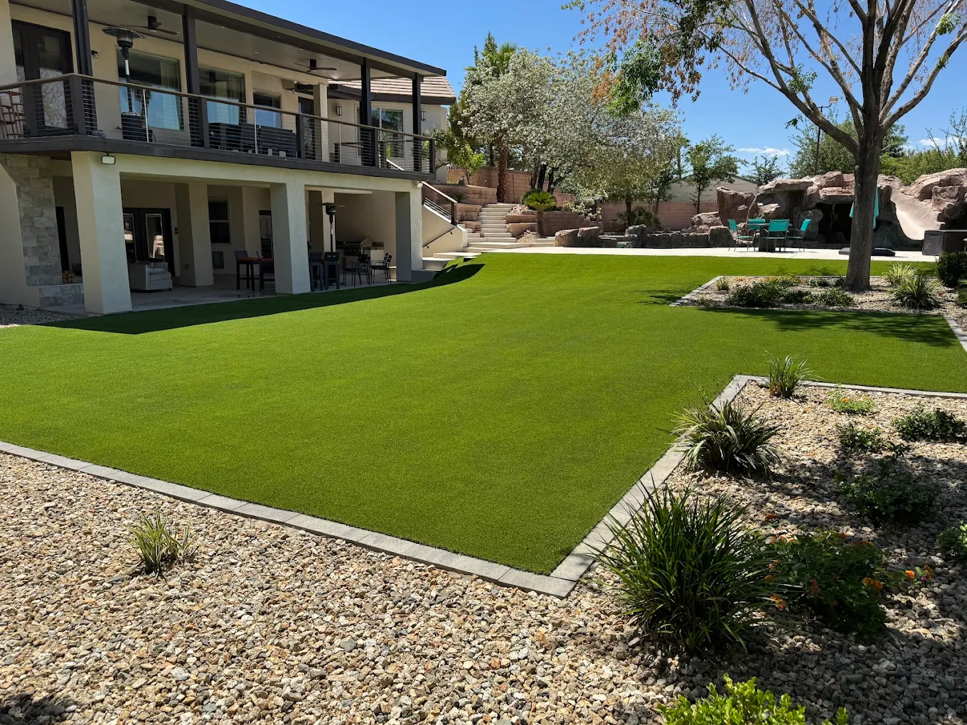Professionally installed artificial turf in a luxury Las Vegas backyard with outdoor living features