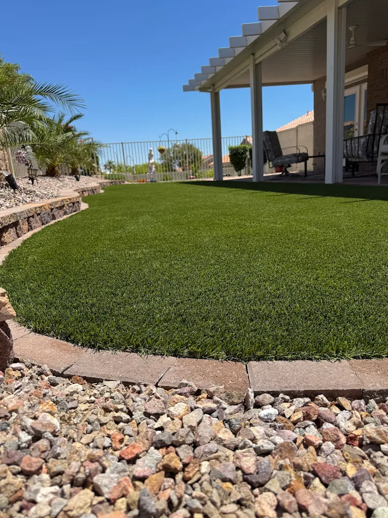 Artificial turf under a pergola in a Las Vegas desert landscape